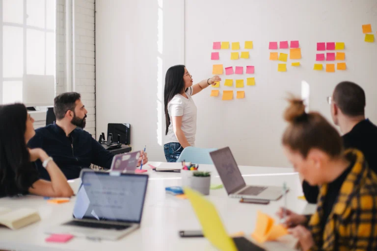 Shopify vs WooCommerce for Small Business: 2026 Cost Guide Small business owner comparing Shopify and WooCommerce online store dashboards on a laptop