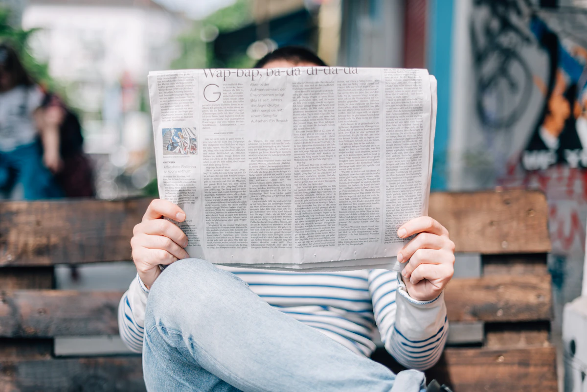 Reader with a newspaper, for The Second Angle magazine case study